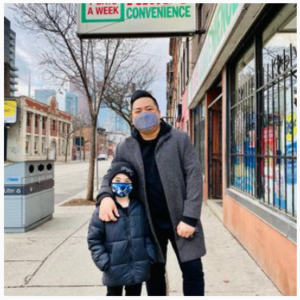 Andrew Phung and his son in front of Kim's Convenience