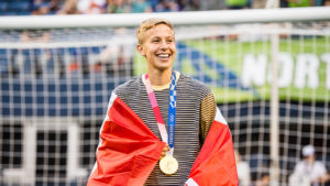 Quinn with their Gold Medal