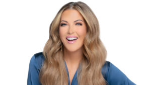 Cheryl Hickey in front of a white backdrop
